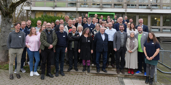 Group photo of participants in front of the venue.